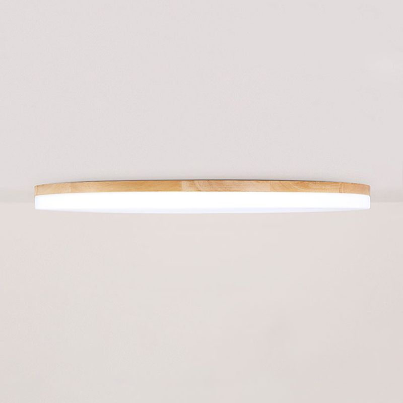 Plafonnier rond en bois à montage affleurant, avec une douce lumière d’ambiance