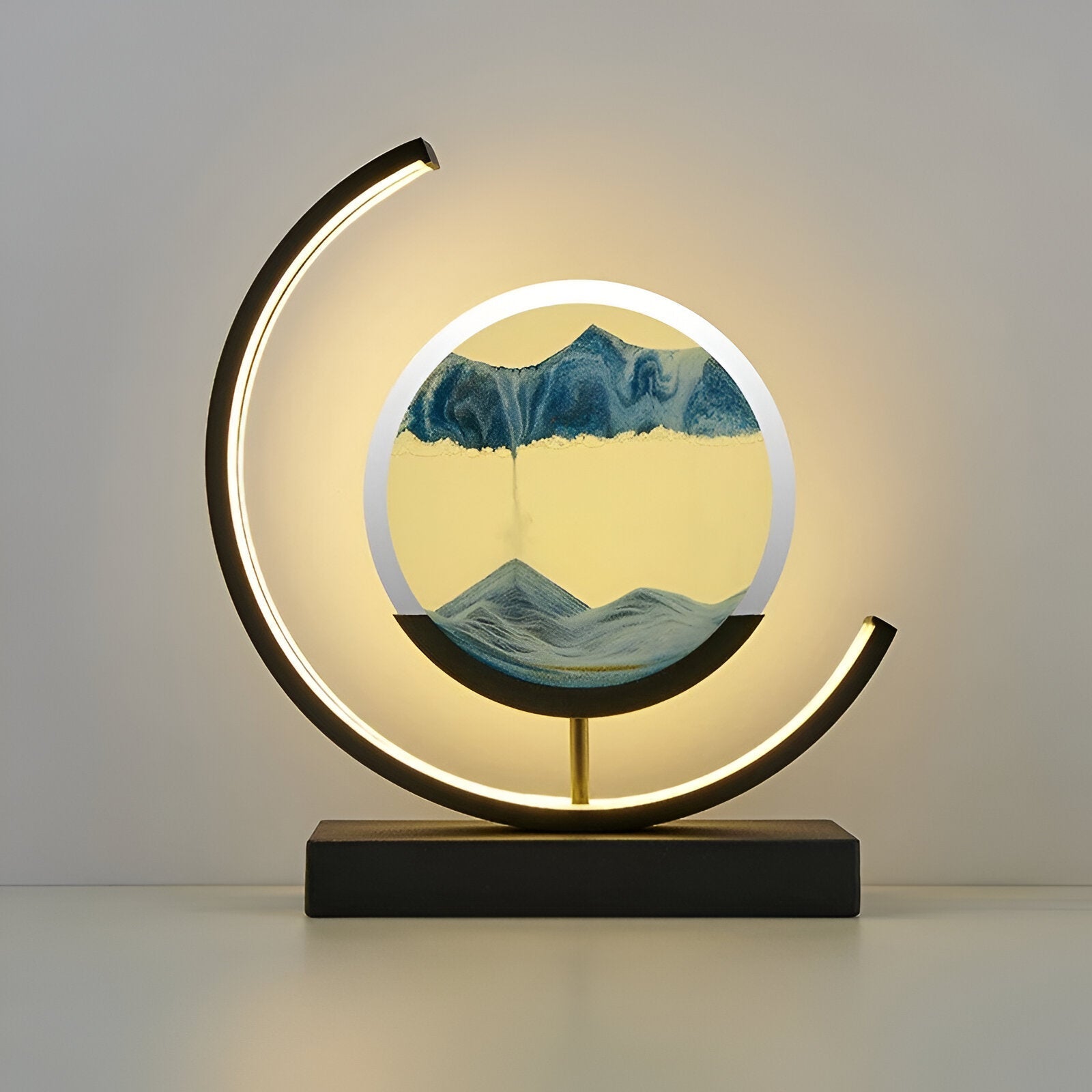 LED sand art table lamp with circular frame