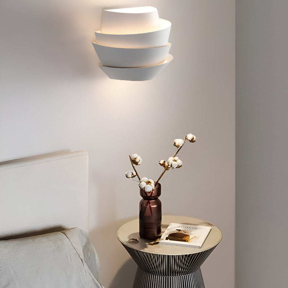 Modern wall lamp with overlapping curved panels