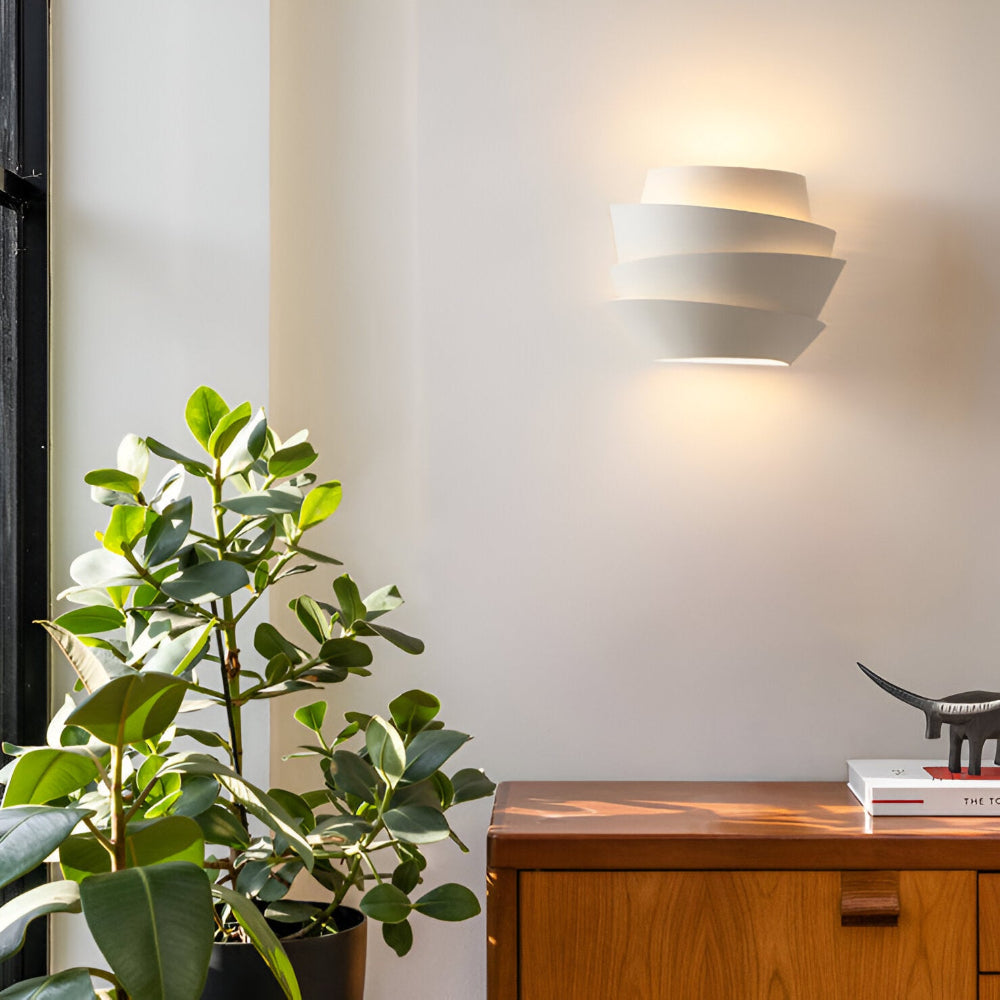 Modern wall lamp with overlapping curved panels