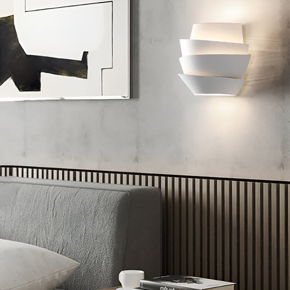 Modern wall lamp with overlapping curved panels