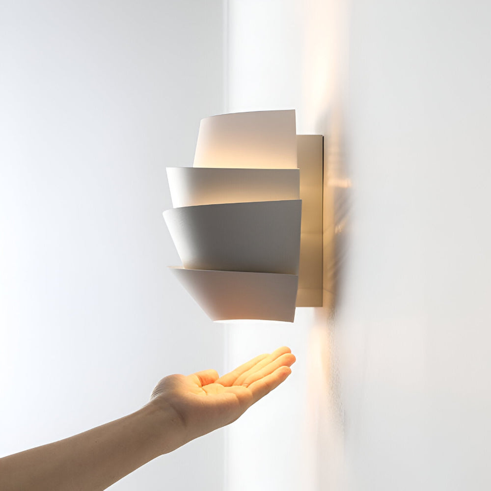 Modern wall lamp with overlapping curved panels