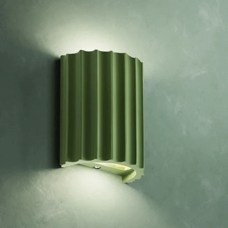 Resin wall light with grooved cylindrical design