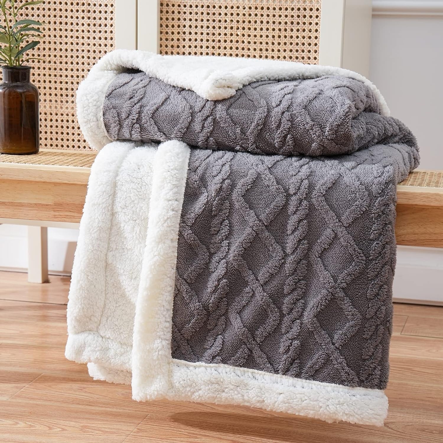 Reversible textured blanket with geometric pattern