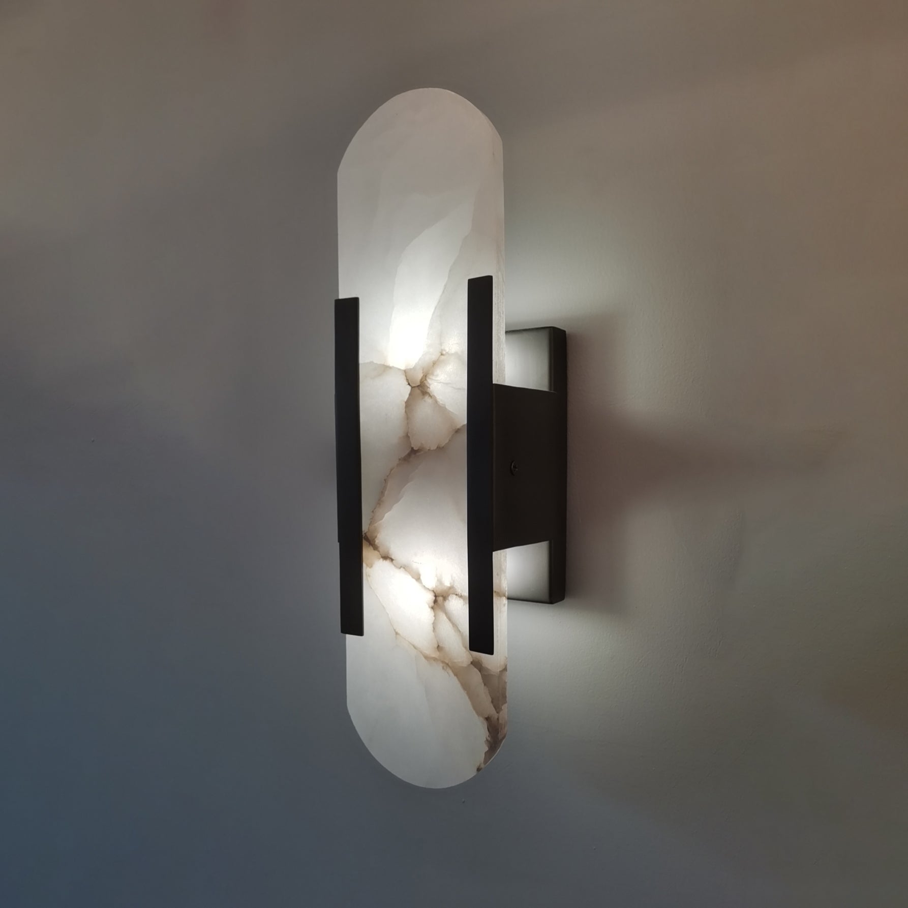 Oval Marble Wall Sconce with Soft LED Ambient Lighting