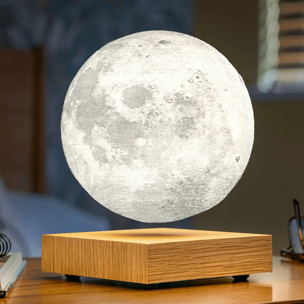 Floating moon shaped light on wooden stand