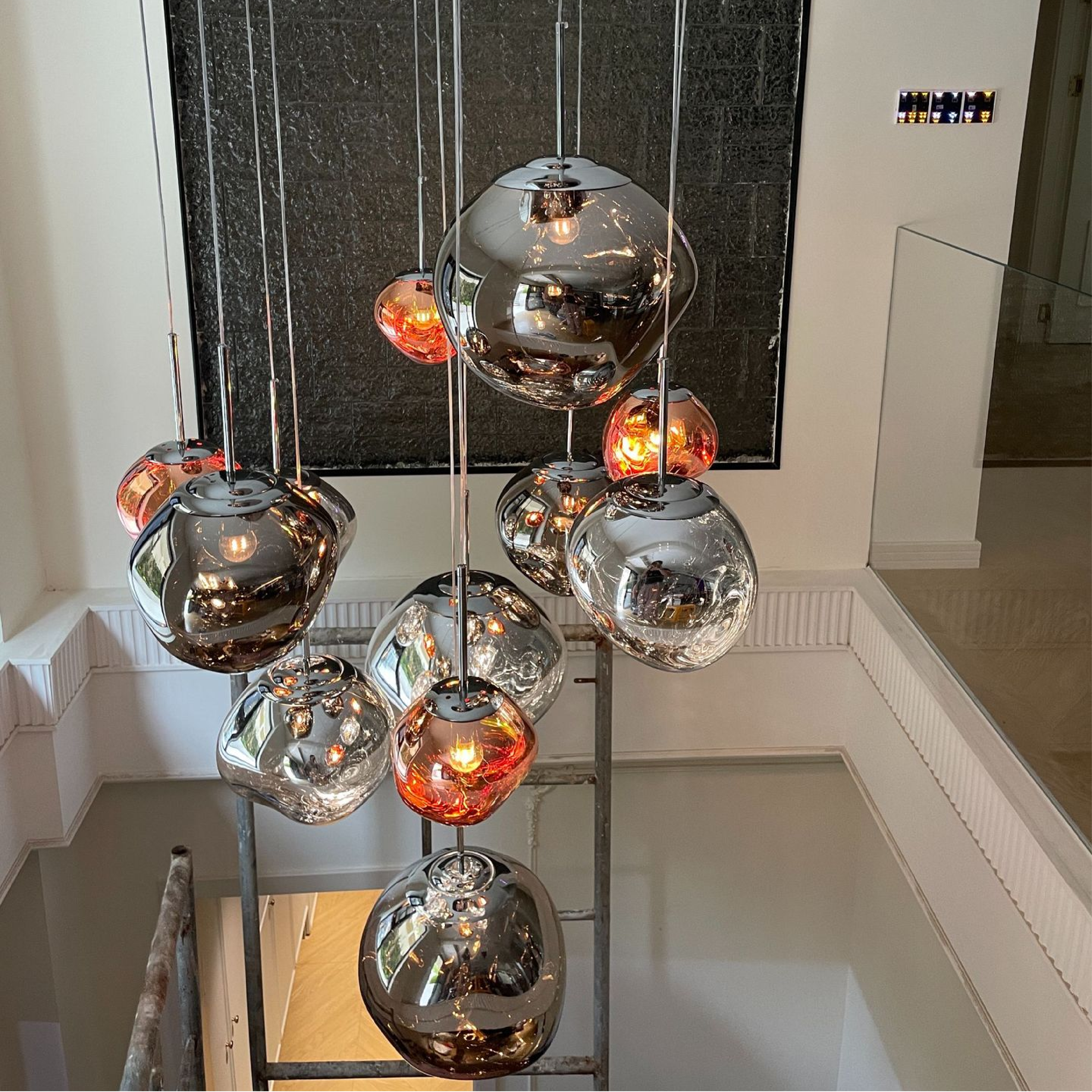 Hanging lamp with molten-style glass globe