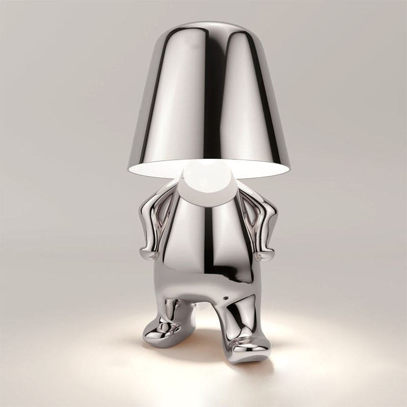 Metallic table light with reflective artistic form
