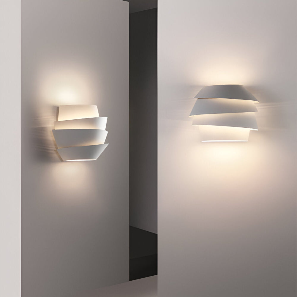 Modern wall lamp with overlapping curved panels