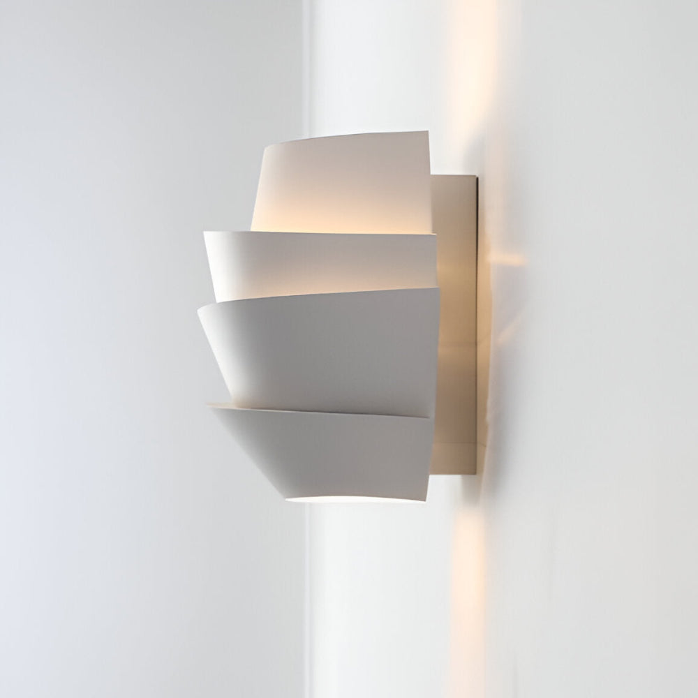 Modern wall lamp with overlapping curved panels