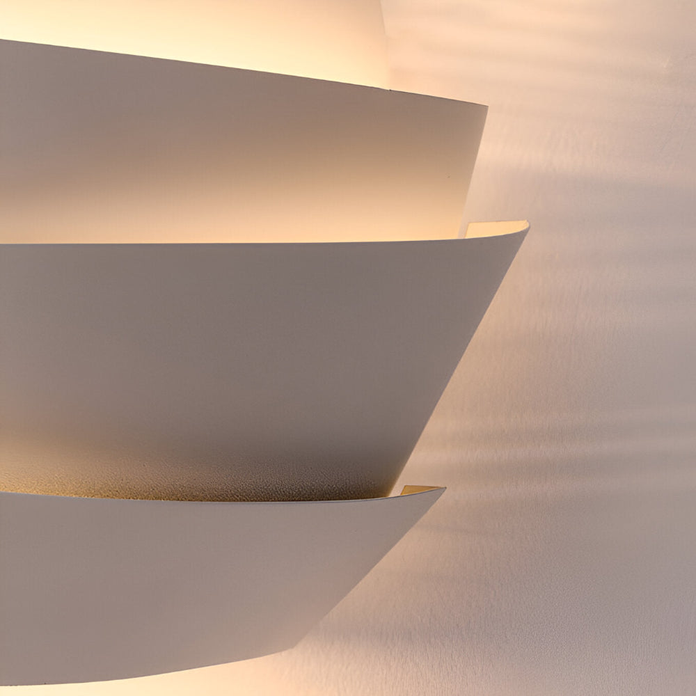 Modern wall lamp with overlapping curved panels