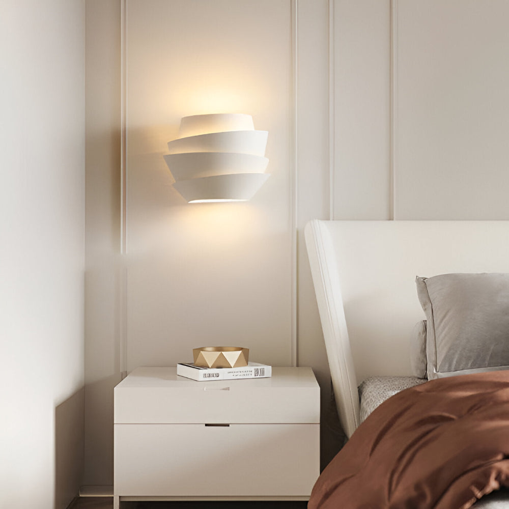 Modern wall lamp with overlapping curved panels