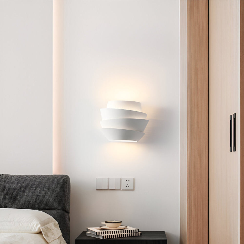 Modern wall lamp with overlapping curved panels