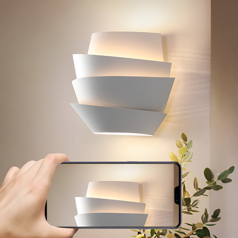 Modern wall lamp with overlapping curved panels