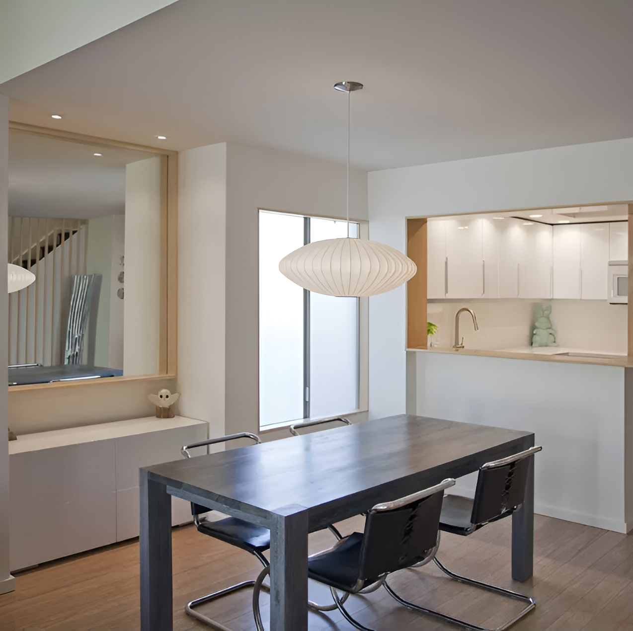 Oval pendant light with vertical lined shade