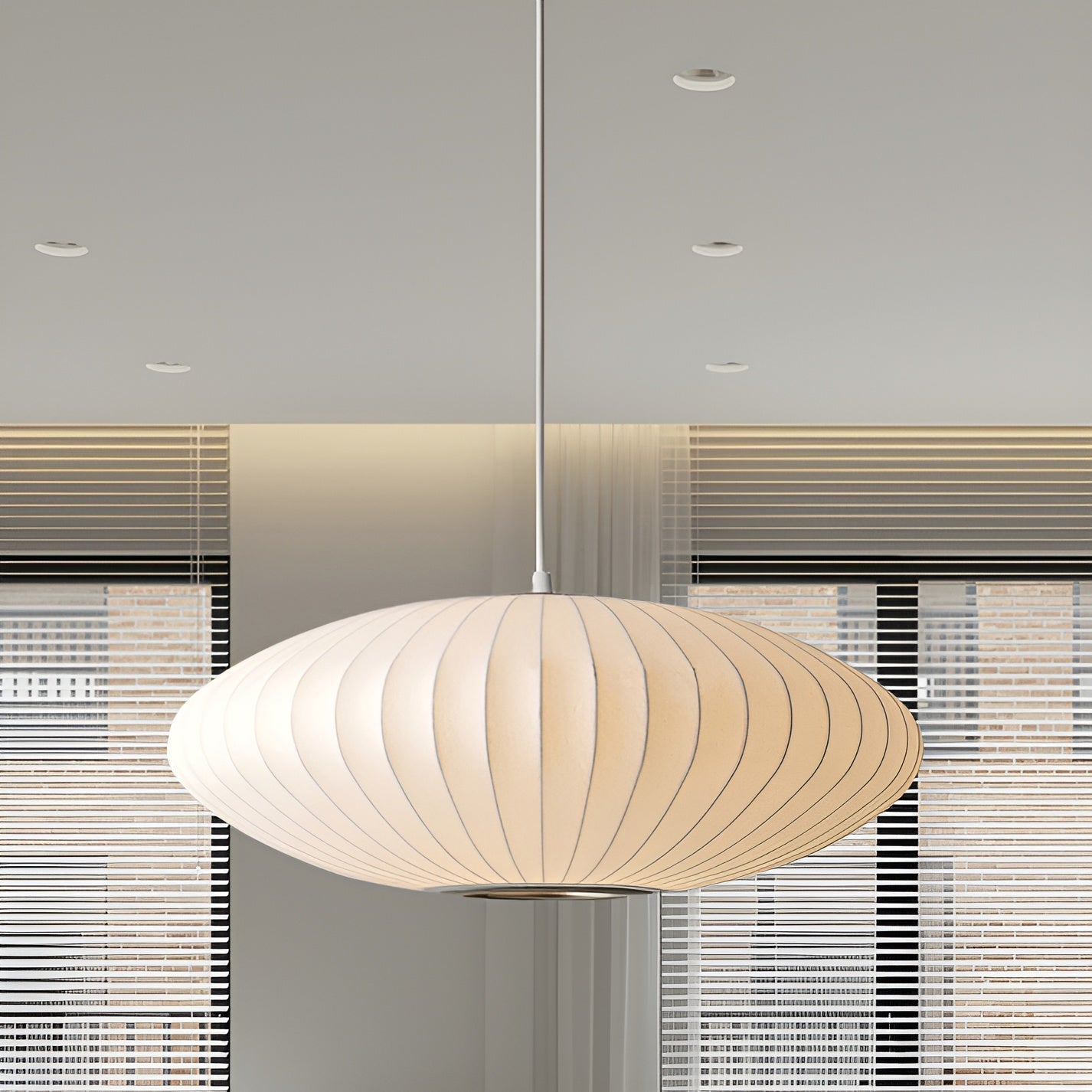 Oval pendant light with vertical lined shade