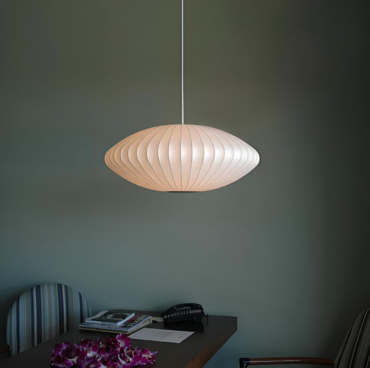 Oval pendant light with vertical lined shade