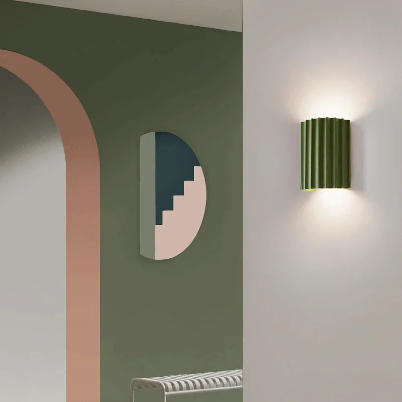 Resin wall light with grooved cylindrical design