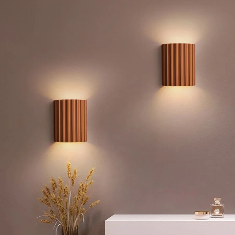 Resin wall light with grooved cylindrical design