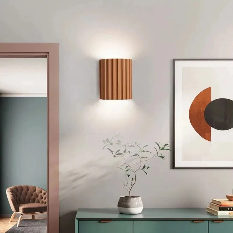 Resin wall light with grooved cylindrical design