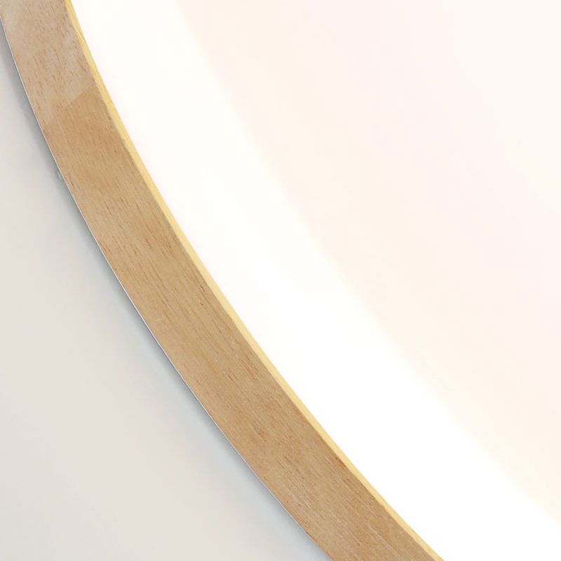 Plafonnier rond en bois à montage affleurant, avec une douce lumière d’ambiance
